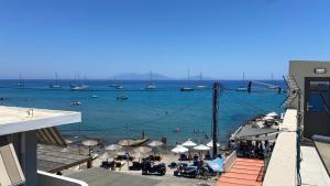 a view of a beach with boats in the water at PAGONI apartments 2 in Kardamaina