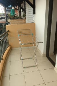 a metal shelf sitting on top of a balcony at Apartamento Cantinho da Cop 30 in Ananindeua