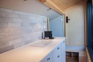 a bathroom with a counter with a sink at Casa Mint in Sozopol +39 photos