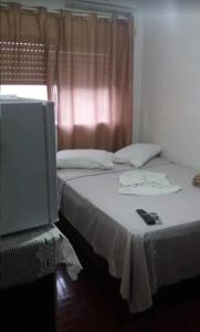Ένα ή περισσότερα κρεβάτια σε δωμάτιο στο Hotel Central