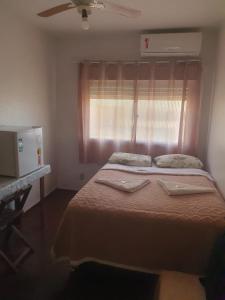 Ένα ή περισσότερα κρεβάτια σε δωμάτιο στο Hotel Central