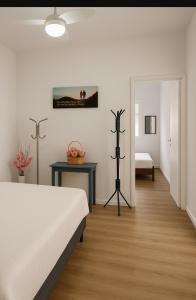 En eller flere senge i et værelse på Apartamento de São Vicente