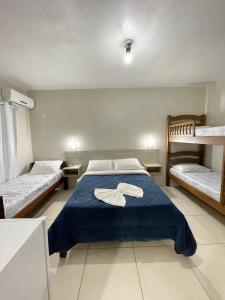Ένα ή περισσότερα κρεβάτια σε δωμάτιο στο Marechal Plaza Hotel