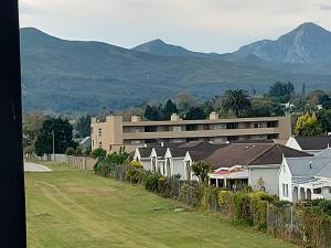 a row of houses with mountains in the background at 309 The Meadows in George
