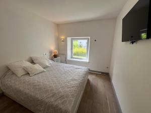 En eller flere senge i et værelse på Superbe appartement 4 a 6 personnes