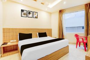 Postel nebo postele na pokoji v ubytování Hotel O Gandhi Hotel