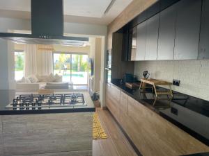 a kitchen with a stove top in a room at boracay island in Tala Lakran