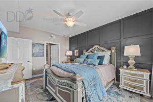 a bedroom with a bed and a ceiling fan at Legacy Tower II 608 Deluxe in Gulfport