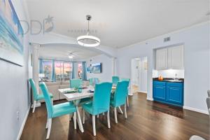 a kitchen and dining room with a table and chairs at Legacy Tower I 304 in Gulfport