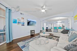 a living room with a couch and a table at Legacy Tower I 304 in Gulfport