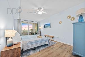 a bedroom with a bed and a ceiling fan at Legacy Tower I 304 in Gulfport