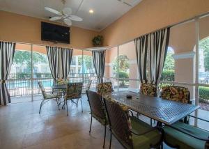 a living room with a table and chairs at Legacy Villa 1504 in Gulfport