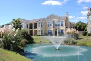 a fountain in front of a house at Legacy Villa 1501 in Gulfport