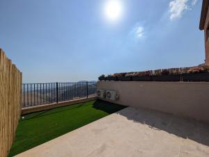 a balcony with a view of the ocean at יחידות נופש מצפה ימים צפת in Safed +8 photos