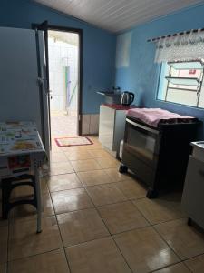 Dapur atau dapur kecil di Casa em Tramandaí +2 gambar