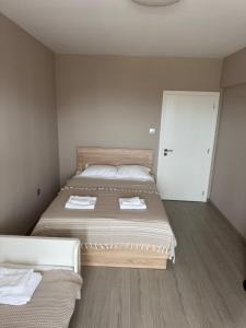 Postel nebo postele na pokoji v ubytování Guest Apart Arda