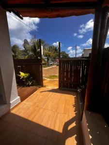a view of a porch with a wooden deck at Casa Brisa Noronha in Fernando de Noronha +23 photos