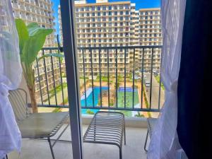 a view of a large building from a window at Cebu Chill Studio Mactan Lapu-Lapu Cebu in Agus