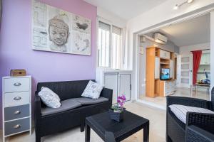 a living room with a couch and a table at Gemelos 22 Resort Apartment 2-15-B Levante Beach in Benidorm