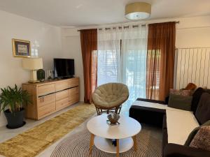 a living room with a couch and a table at Soko holiday home Bihac in Bihać