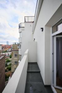 a view from the balcony of a white building at Apartment La Barrière 6 in Brussels