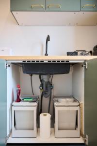 a sink and two toilets under a counter at Apartment La Barrière 6 in Brussels +32 photos