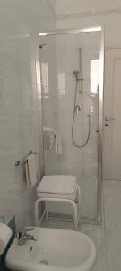 a white bathroom with a shower and a sink at HOME SWEET HOME Casa vacanze e affitti brevi in Trani