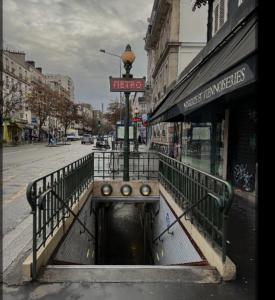 a city street with a bridge over a canal at flowers room au coeur de saint Ouen parking gratuit in Saint-Ouen