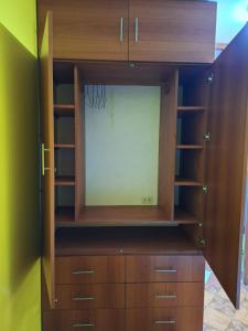 a large wooden entertainment center in a room at Apartamento Familiar Tacna Bonita in Tacna
