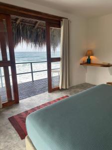 Ένα ή περισσότερα κρεβάτια σε δωμάτιο στο Finca Barlovento Cabaña, Tayrona