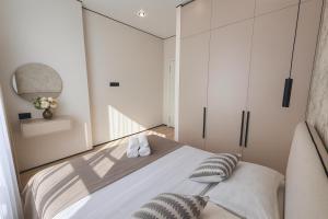 a bedroom with a bed and a mirror at Уютная квартира в ЖК Республика in Astana