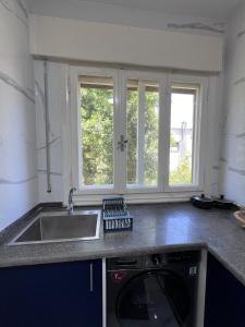 Η κουζίνα ή μικρή κουζίνα στο Sunlight apartment