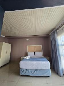 Ένα ή περισσότερα κρεβάτια σε δωμάτιο στο Limpopo LidoSystem Lodge +36 φωτογραφίες