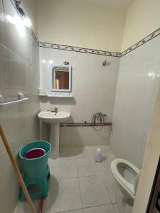 a bathroom with a sink and a toilet and a sink at Little spot in Al Hoceïma