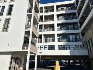 an apartment building with balconies on the side of it at 51 Lazarett Loft & Car Rental in Windhoek