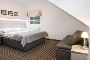 Posteľ alebo postele v izbe v ubytovaní Horský Hotel Dobrá Chata