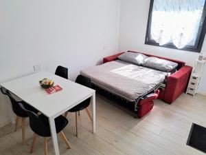 Ένα ή περισσότερα κρεβάτια σε δωμάτιο στο Appartamento Aurora in Valtellina - Accogliente alloggio tra lago e montagna