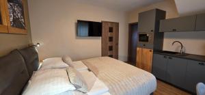 Voodi või voodid majutusasutuse Apartmány Špacír 3 toas