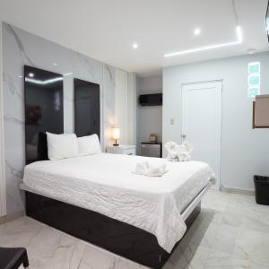 Postel nebo postele na pokoji v ubytování Hotel Vista Verde