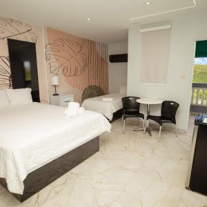 Postel nebo postele na pokoji v ubytování Hotel Vista Verde
