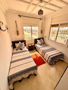 En eller flere senge i et værelse på Balance Surf Morocco , Quality rooms , Moroccan food , Activities