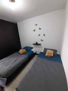 Postel nebo postele na pokoji v ubytování Perfectas Vacaciones a minutos de Parques Tematicos + 9 fotografií