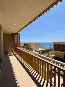 a balcony of a building with a view of the ocean at Rei Green Coast Villa in Himare