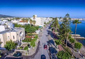 an aerial view of a street in a city next to the water at Pantheon Apartments Kos Town in Kos