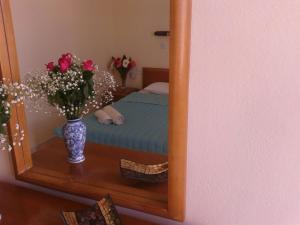
A bed or beds in a room at Pantheon Apartments Kos Town
