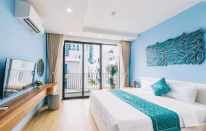 a bedroom with a large bed and a large window at Moonlight Villa Vlasta Sam Son in Thanh Hóa +29 photos