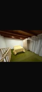 a room with a bed and a bed frame at El pino in San Pedro
