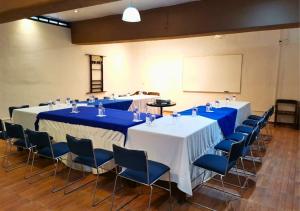 a group of tables and chairs in a room at Hotel Real Campestre Tepetoci in Tepexi del Río +77 photos