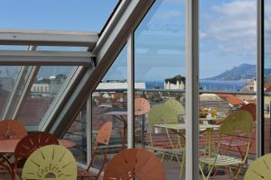 a view of a balcony with a table and chairs at L'Esterel in Cannes