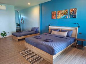 Postel nebo postele na pokoji v ubytování ลานแลเล รีสอร์ท ชุมพร Larn-Lae-Lay Resort Chumphon + 25 fotografií